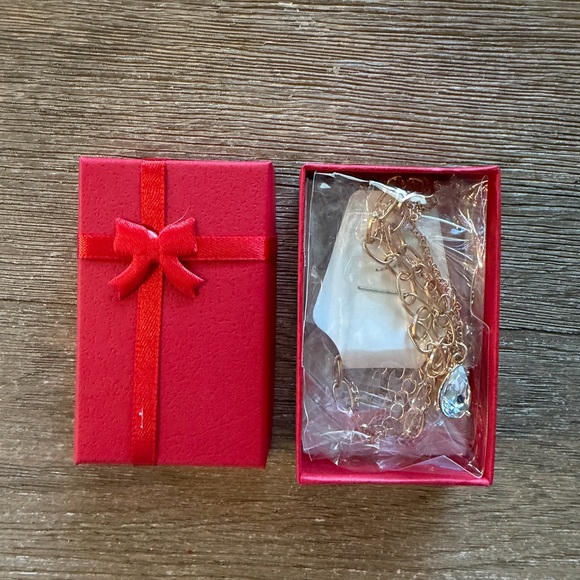 Gold Tone Layered Necklace with Crystal Teardrop Pendant - Picture 8 of 10